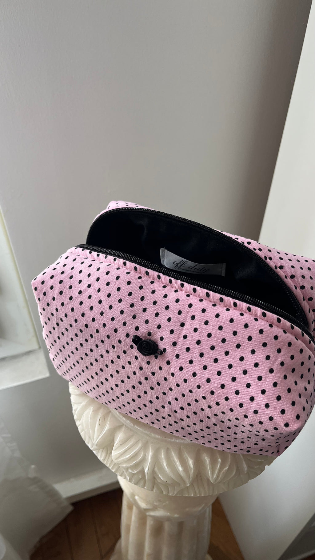 Pink and black polka dot pouch with black rose button