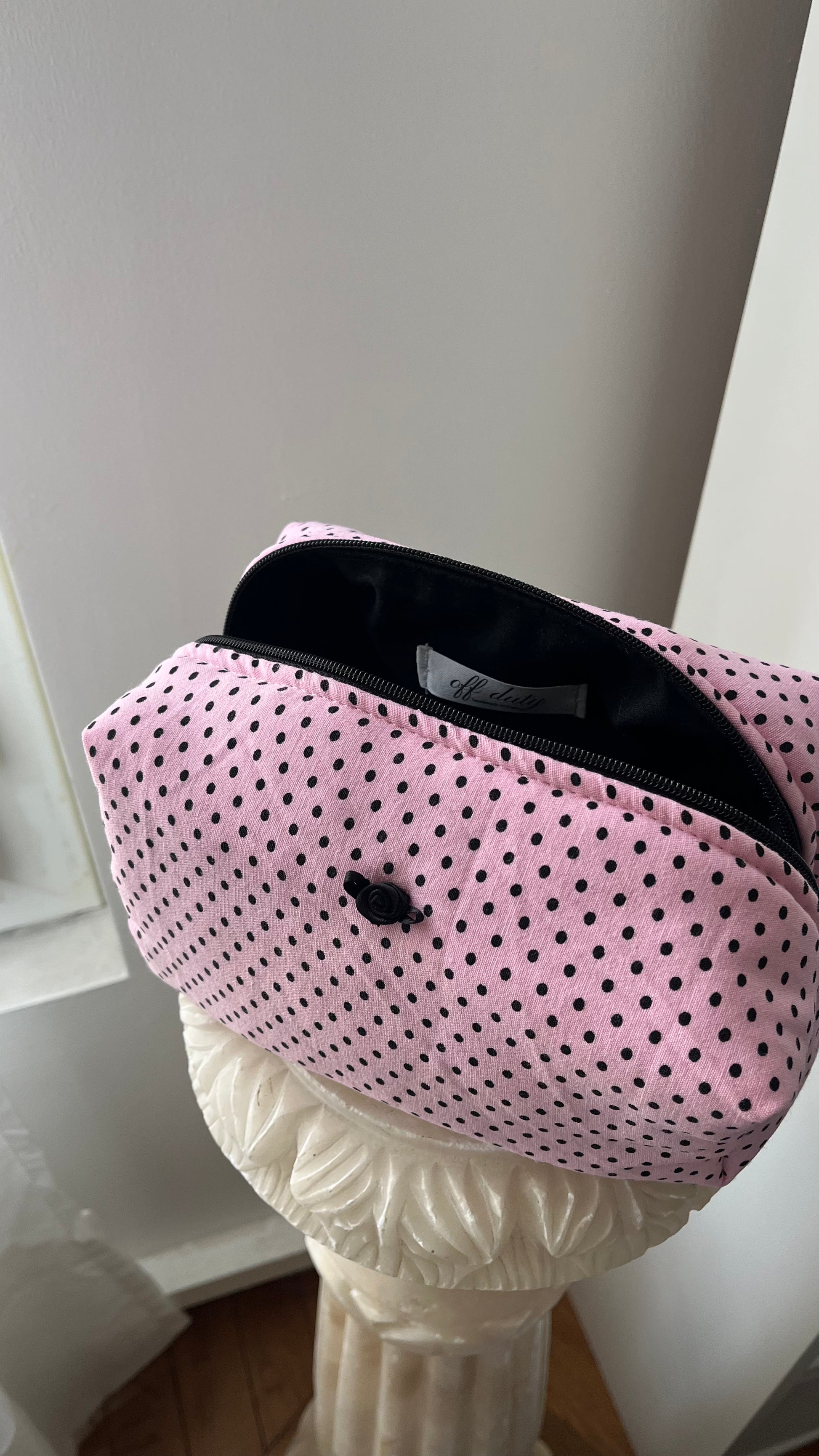 Pink and black polka dot pouch with black rose button